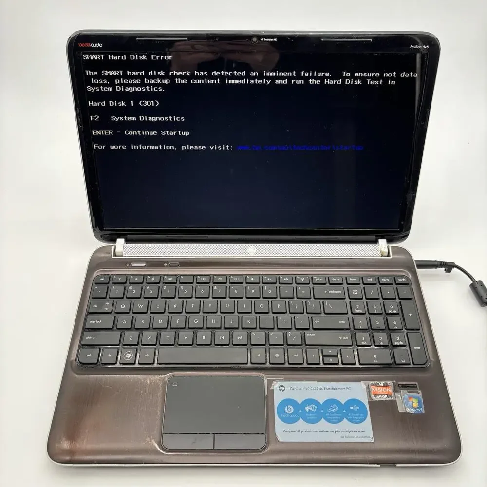 3 HP Laptop Computers With Cords. And 1 Samsung Laptop For Parts And Repair.
